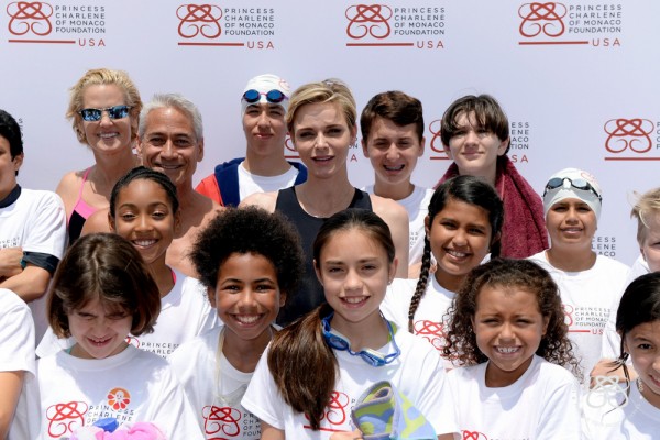 "SANTA MONICA, CA - MAY 11: U.S. Olympic Swimmer, Dara Torres, U.S. Olympic Diver, Greg Louganis and Founder, Princess Charlene of Monaco Foundation, Princess Charlene of Monaco teach children how to swim and practice water safety at The Princess Charlene of Monaco Foundation-USA Official Launch at the Annenberg Community Beach House on May 12, 2016 in Santa Monica, California. (Photo by Kevork Djansezian/Getty Images for Palais Princier de Monaco)"